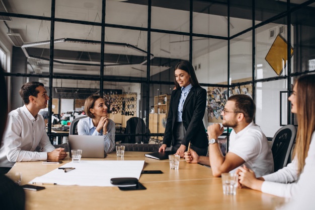 group-people-working-out-business-plan-office_1303-15870